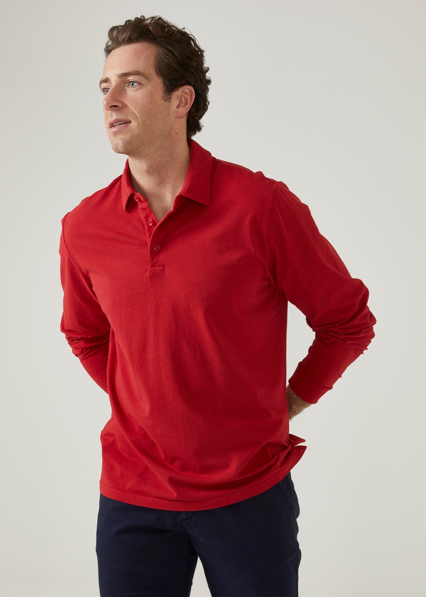 Faded dye polo shirt in rosso red made from a cotton/ spandex blend.